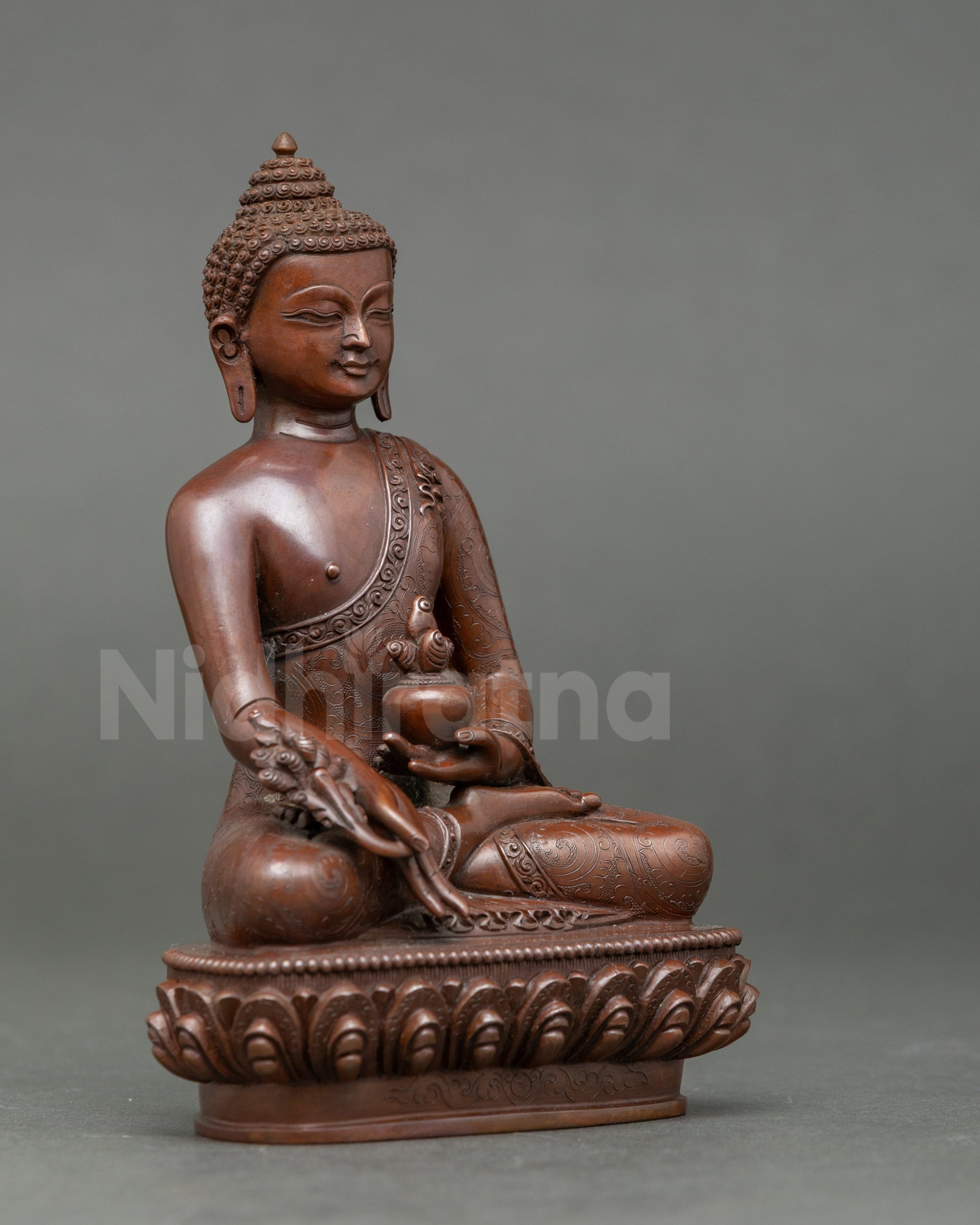 Side view of Nepalese Healing Buddha statue seated on lotus throne for home altar or meditation