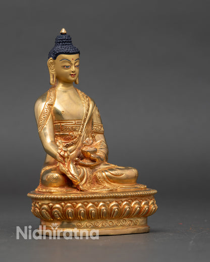 Side view of Nepalese Medicine Buddha on lotus throne holding medicinal bowl and healing herb