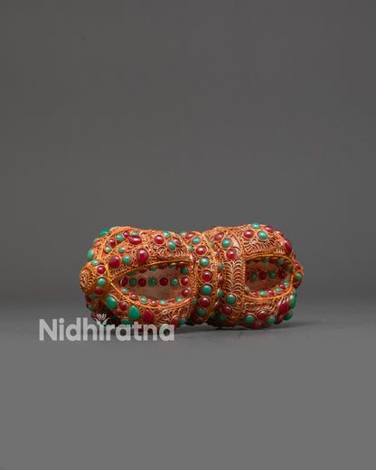 Side view of Nepalese Vajra with intricate gold and copper filigree details