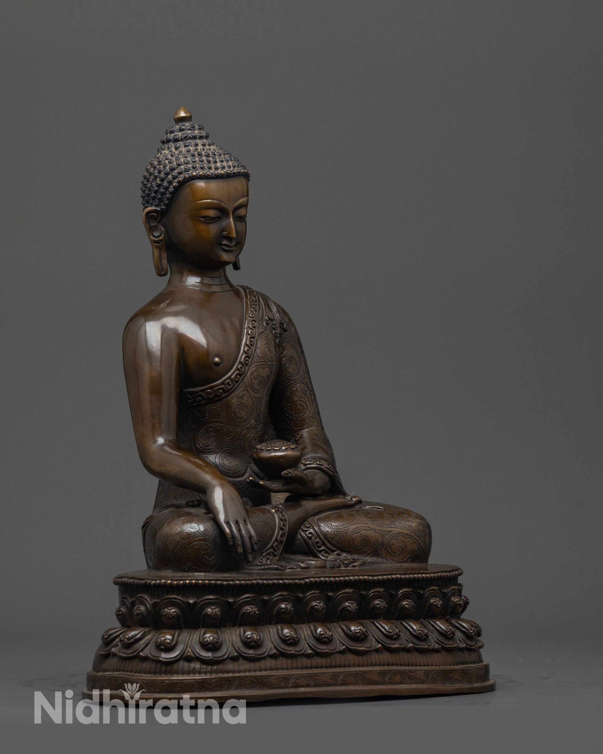 Side view of Oxidized Gautama Buddha Statue displaying oxidized copper and carved robe