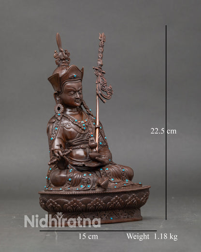 Side view of Padmasambhava statue, Nepalese lost-wax cast, adorned with gemstones
