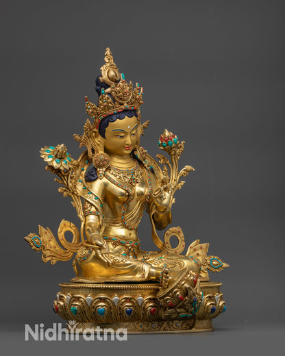 Side view of Premium Green Tara statue showing double ease posture and flower stem
