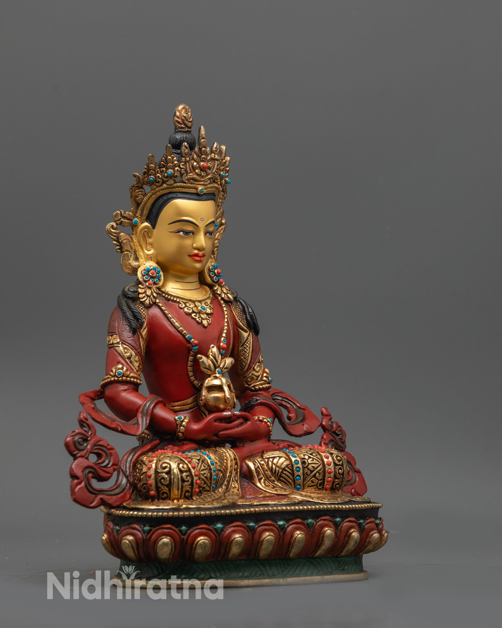 Side view of Red Hued Amitayus Buddha holding nectar vase on multi-colored lotus seat