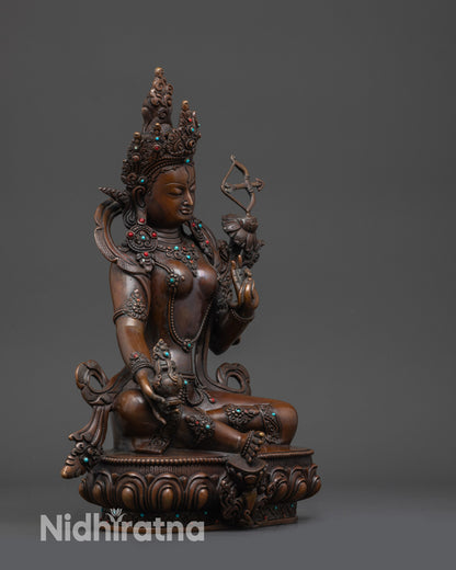 Side view of Red Tara showing double ease posture, flowing robes, and semi-precious stones