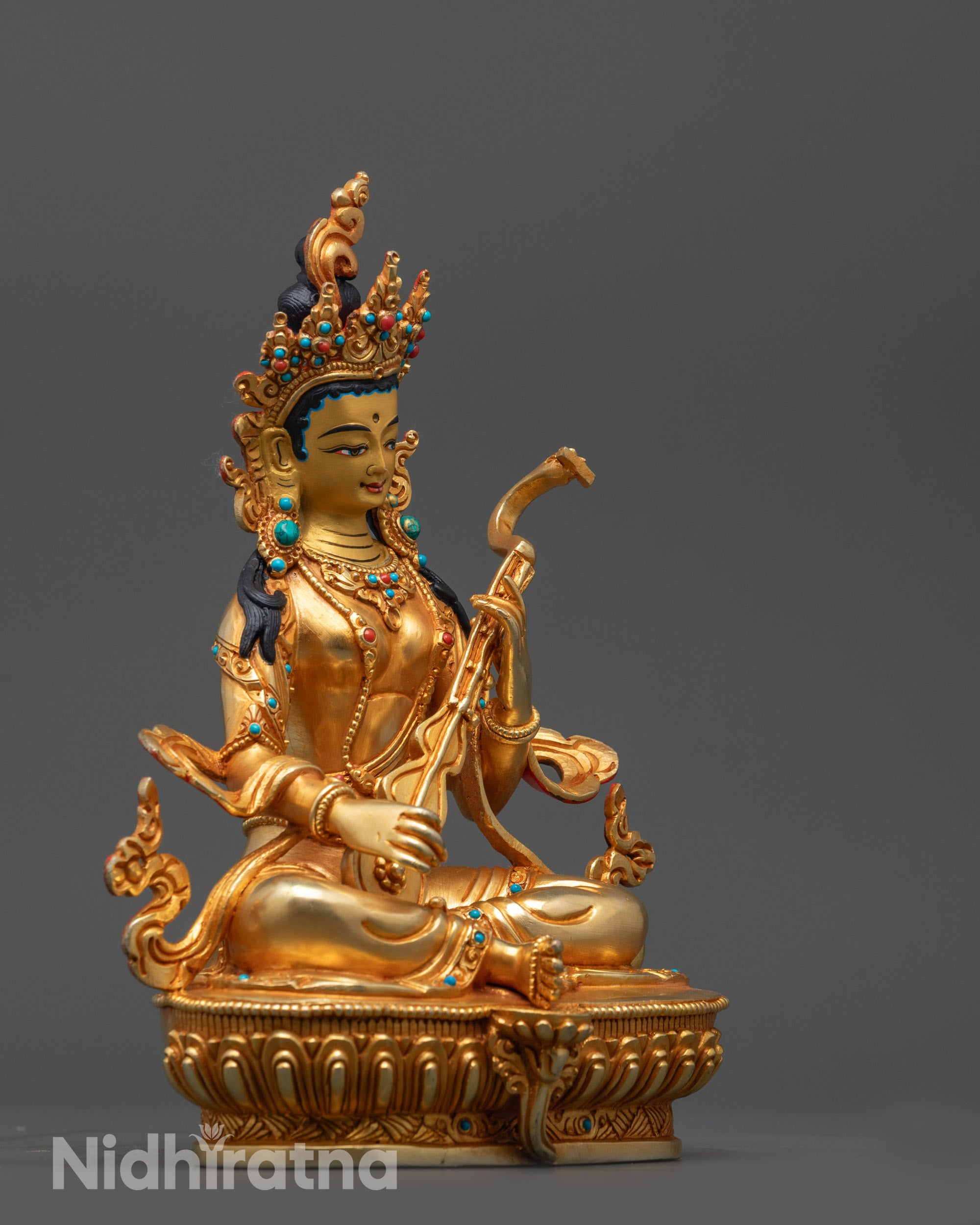 Side view of Saraswati Statue handcrafted copper base with detailed artistry