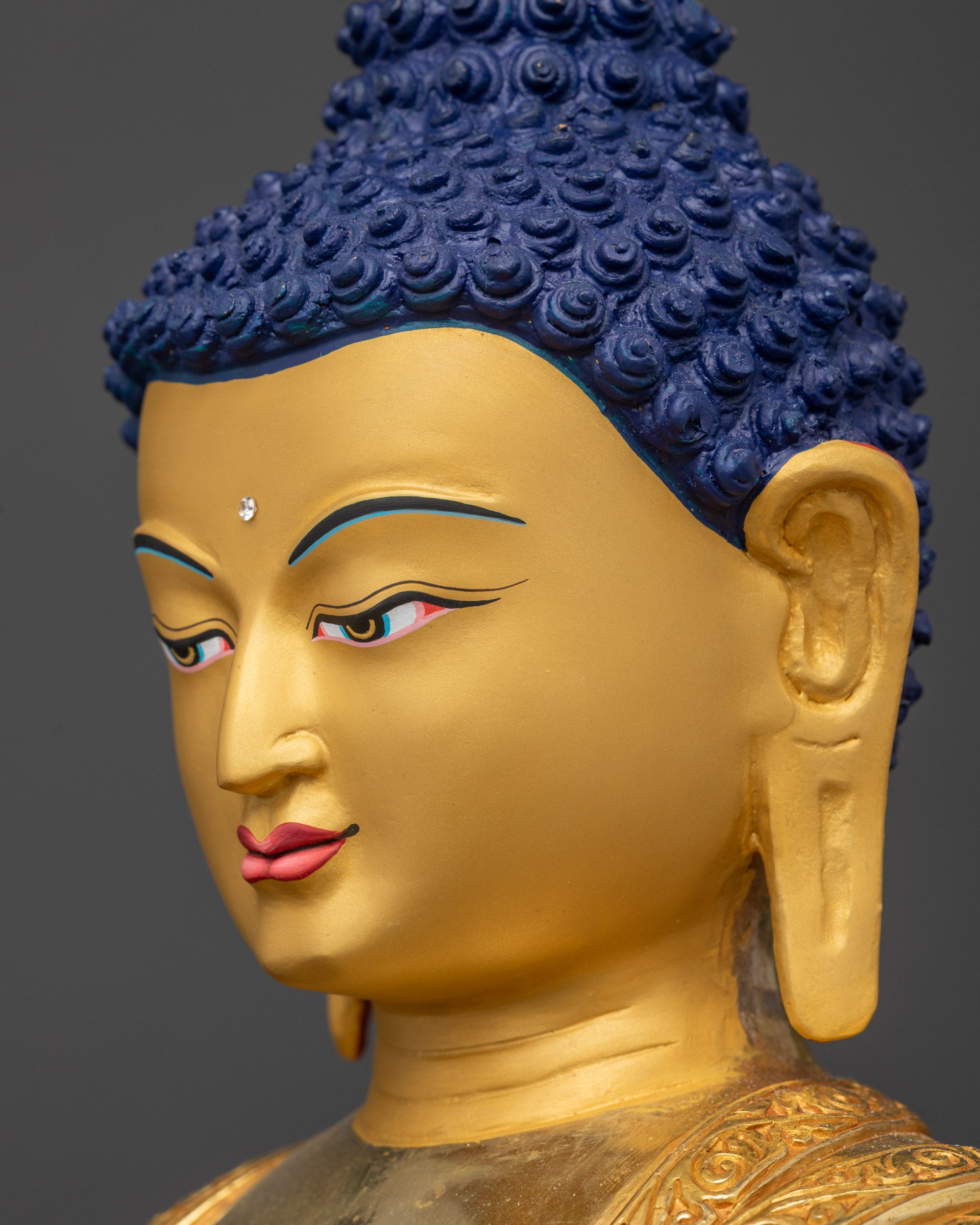 Side view of Shakyamuni Buddha Sculpture highlighting carved garments
