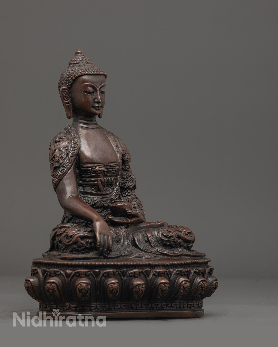 Shakyamuni Buddha Statue showing detailed robe patterns and hollow chamber for mantra insertion.