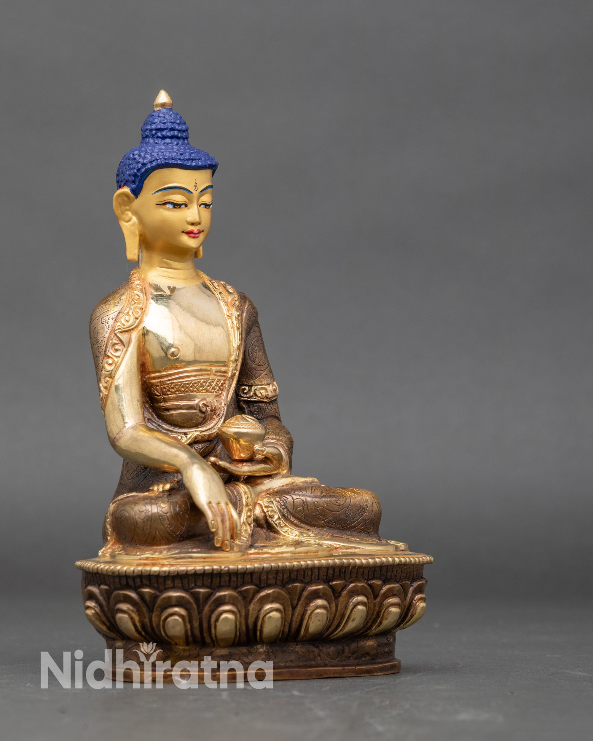 Side view of Shakyamuni Buddha statue seated on lotus, for Buddhist spiritual practice
