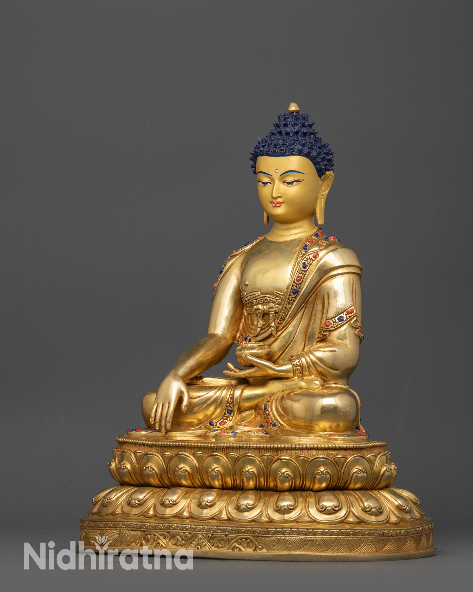 Side view of Shakyamuni Buddha statue showing bhumisparsha mudra and robe details