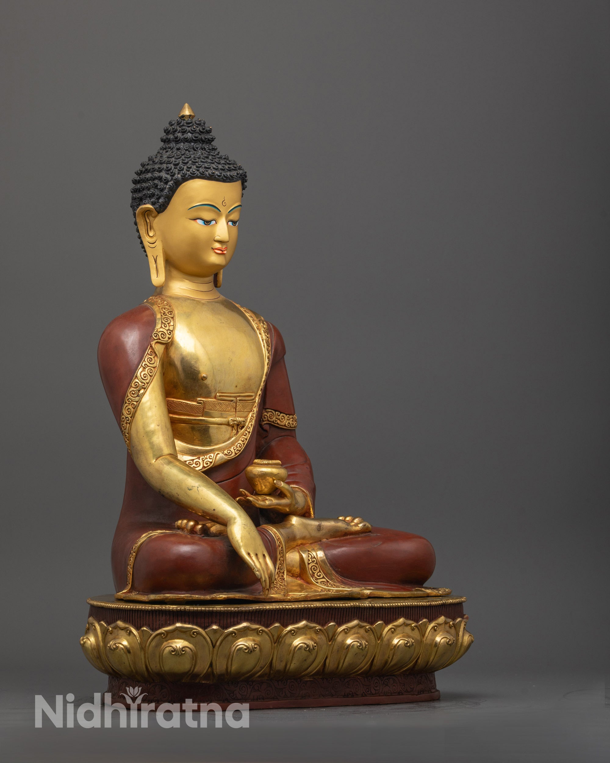 Side view of Shakyamuni Buddha statue showing intricate details