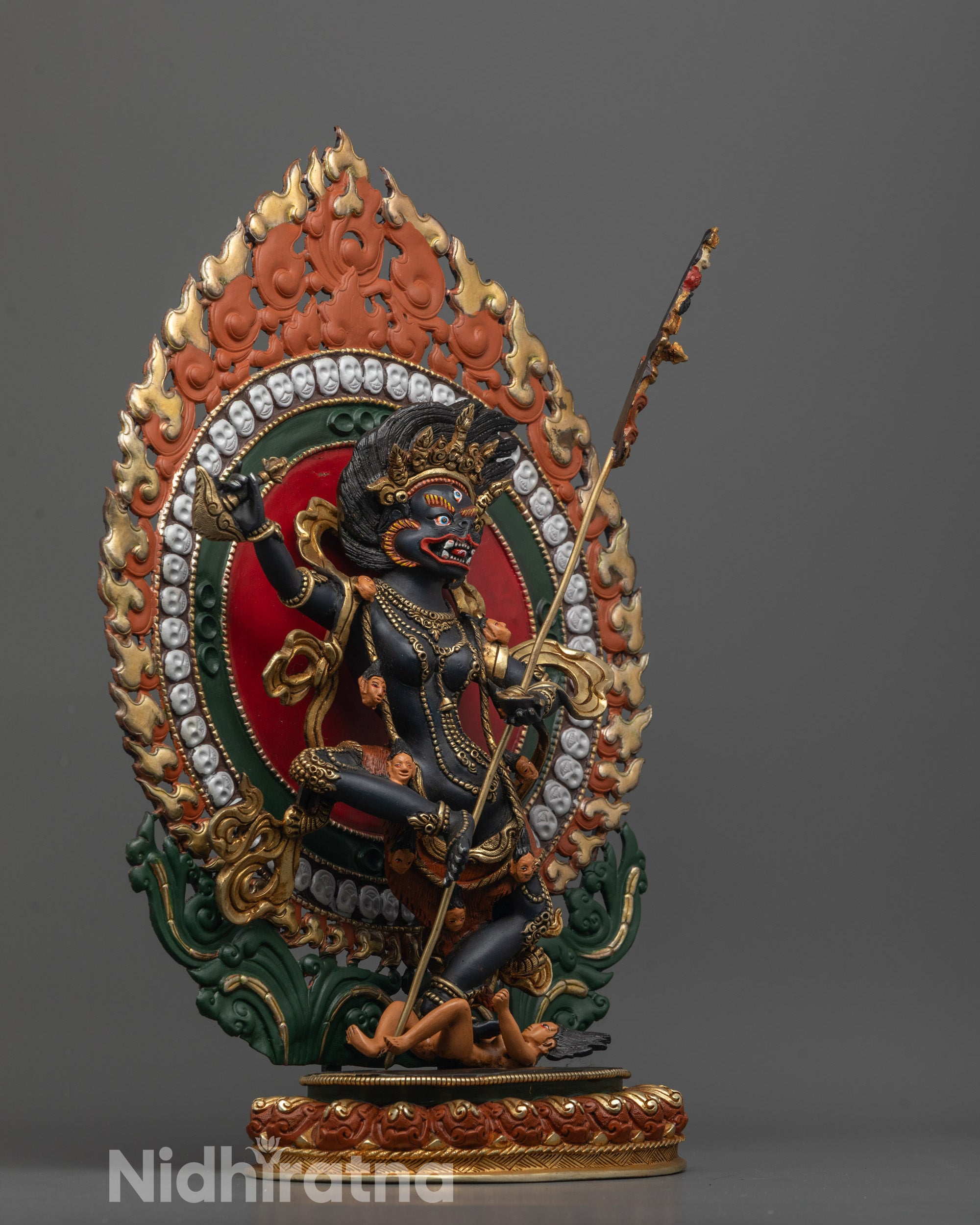 Side view of Singha Mukha Statue depicting dancing posture on lotus base