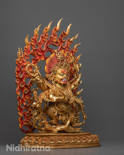 Side view of Six Armed Mahakala statue showing intricate hand-carved details