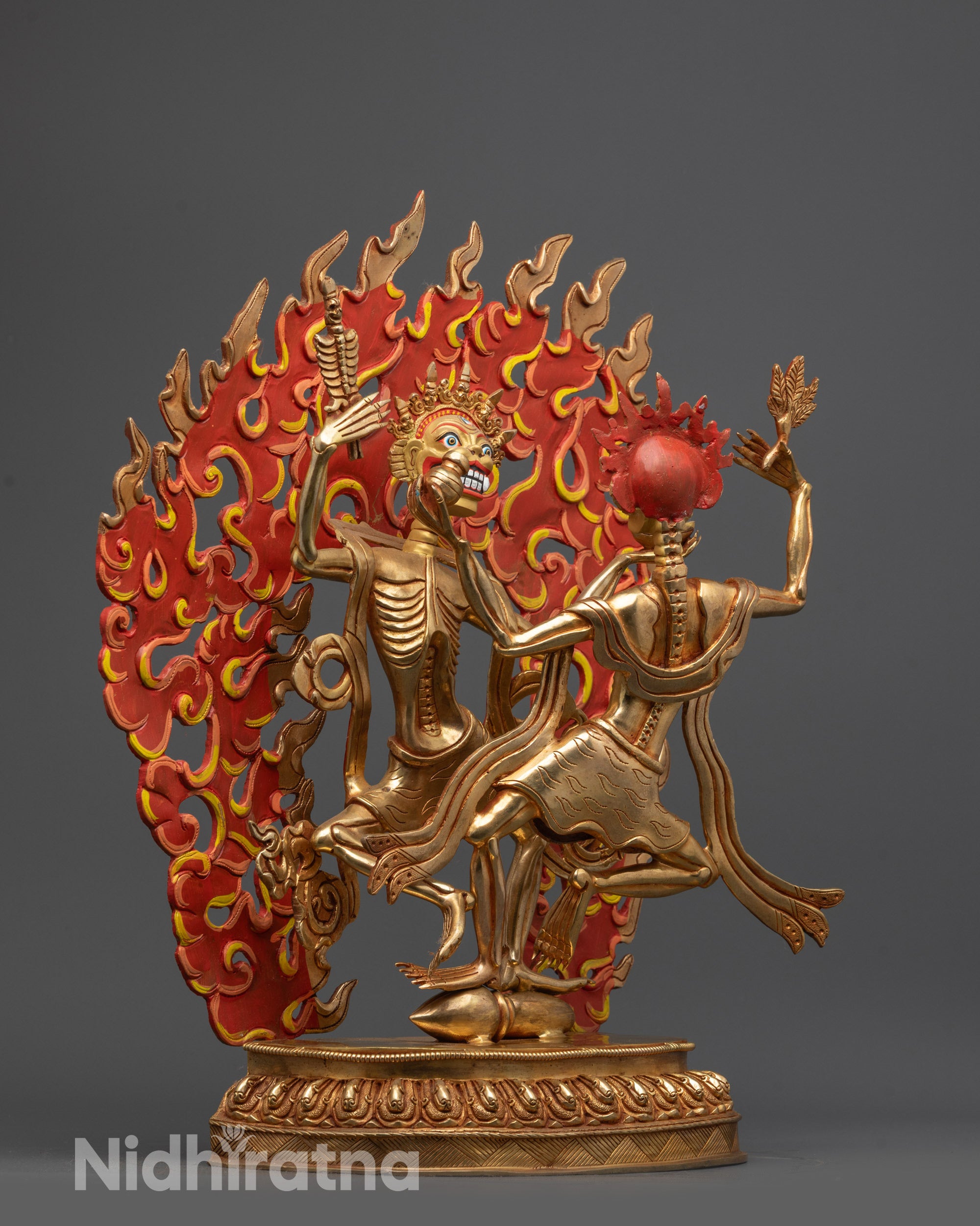 Side view of Skeleton Deity Chitipati Sculpture showing flowing robes and sacred objects