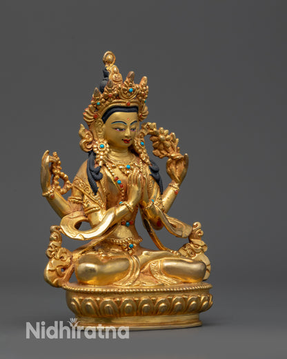 Side view of Tibetan Chenrezig Statue with flowing robes and four-armed iconography
