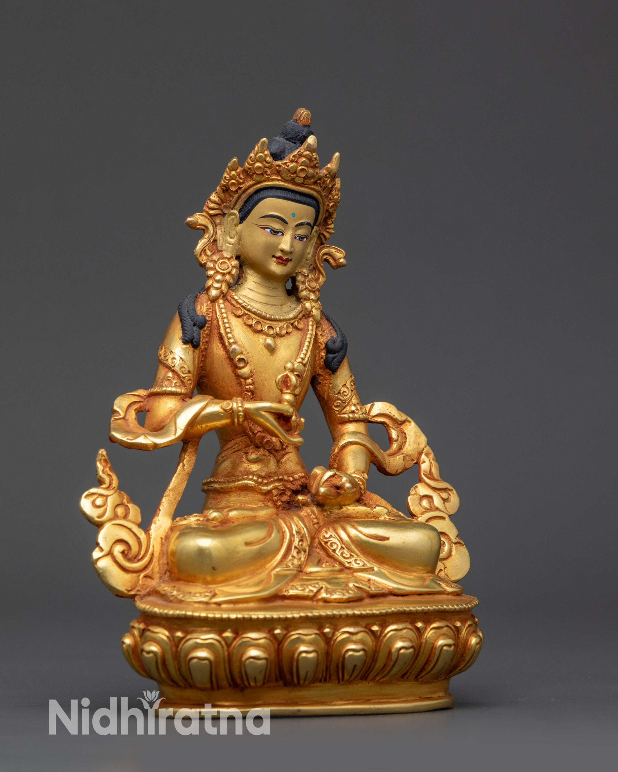 Side view of Tibetan Dorje Sempa statue displaying flowing robes and serene expression
