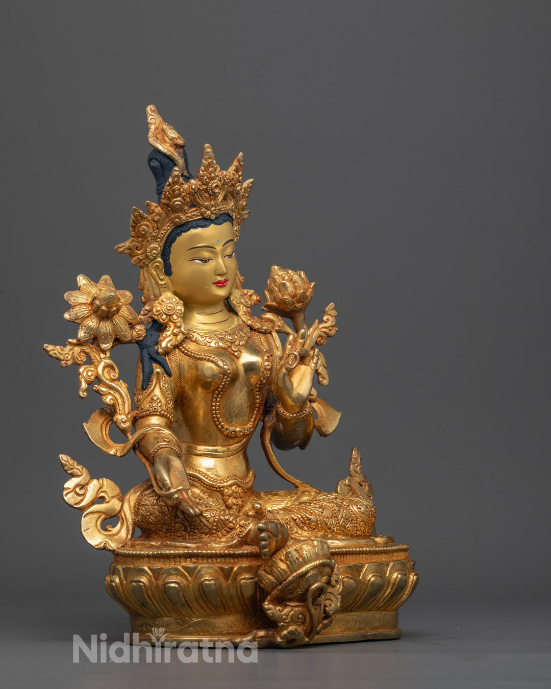 Side view of Traditional copper-based Green Tara sculpture featuring hollow chamber