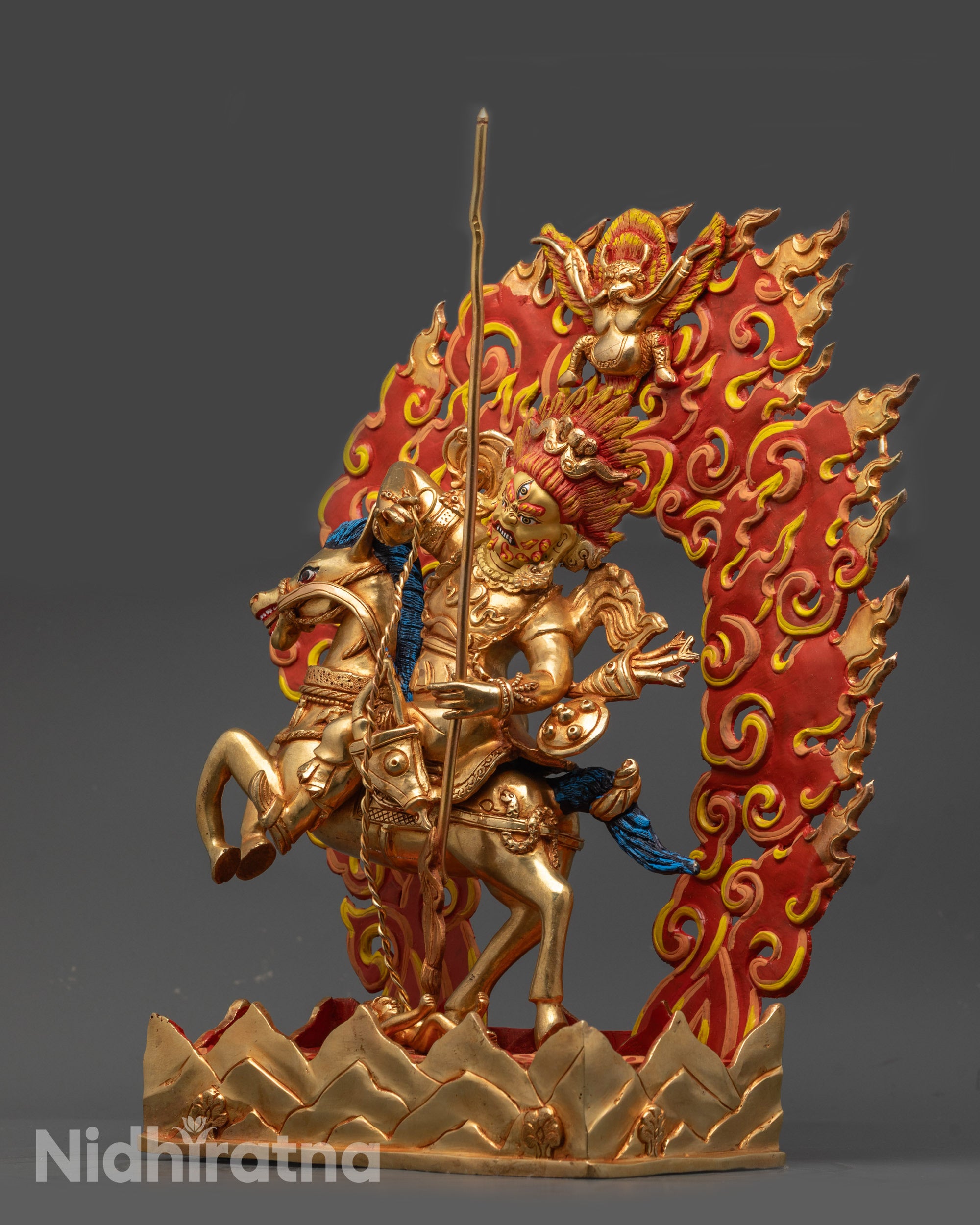 Side view of Tsengo Rolpa Chudan Statue riding horse with blazing halo and miniature Garuda
