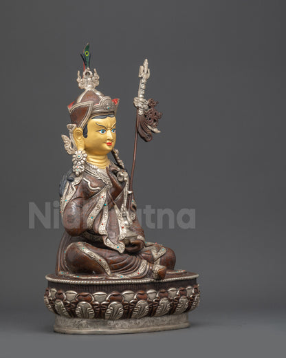 Side view of Tsokye Dorje Buddha sculpture holding vajra and skull cup lotus seat