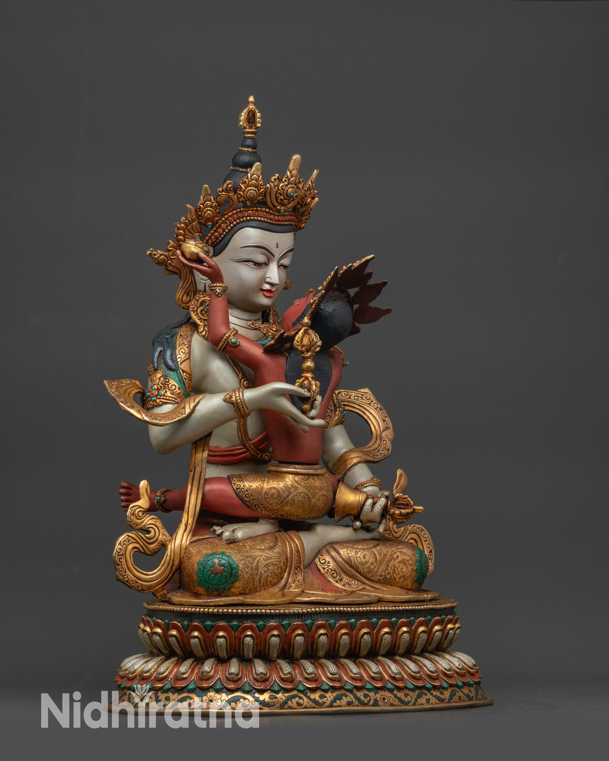 Side view of Union Dorje Sempa Yab-Yum statue on lotus seat
