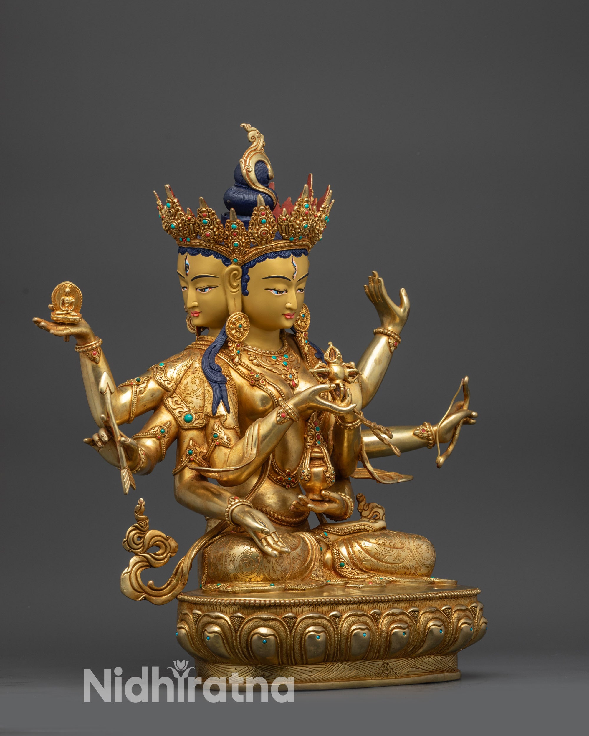 Side view of Ushnishavijaya Namgyalma statue showing lotus seat and sacred implements