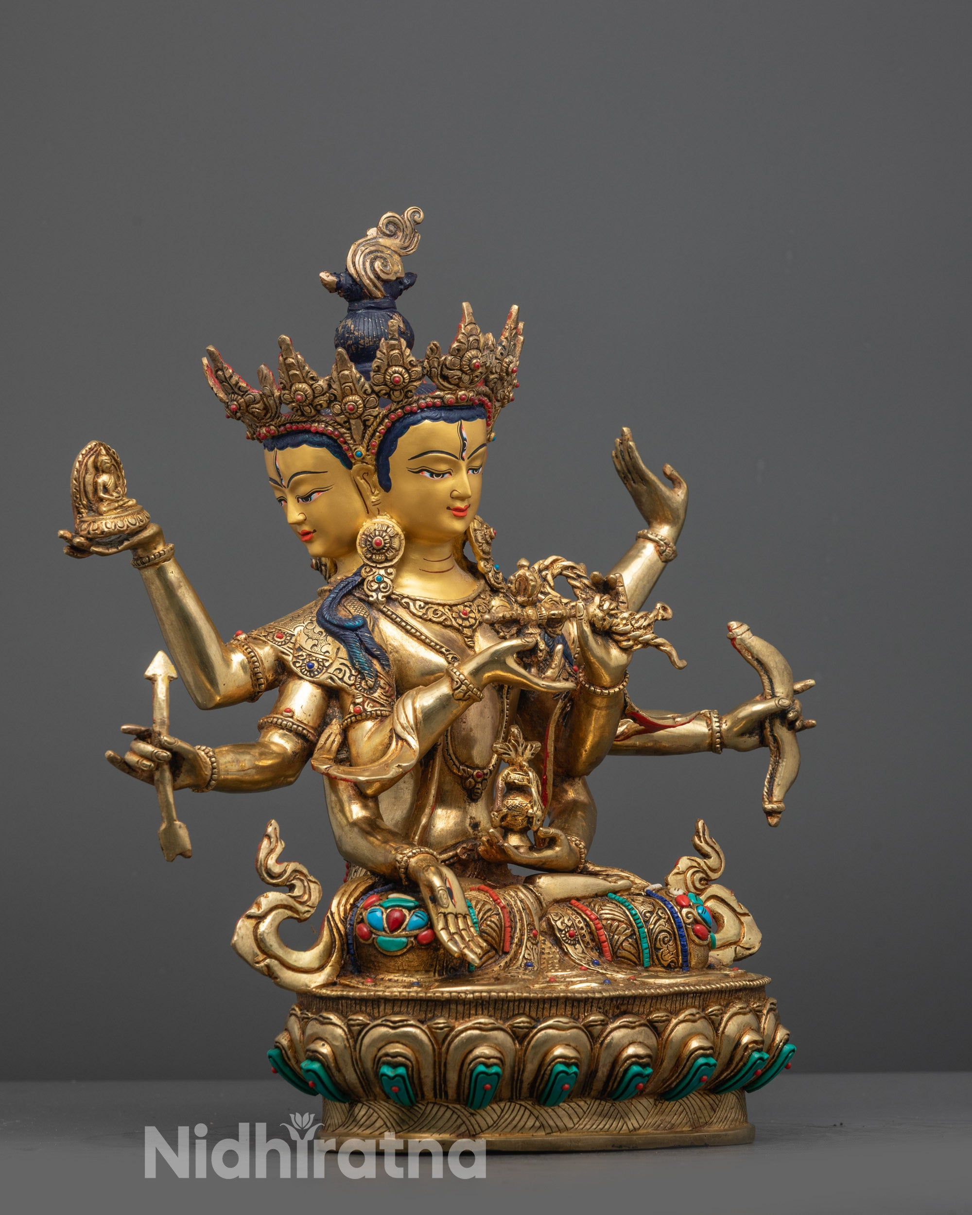 Side view of Usnisavijaya Namgyalma Statue seated on lotus throne