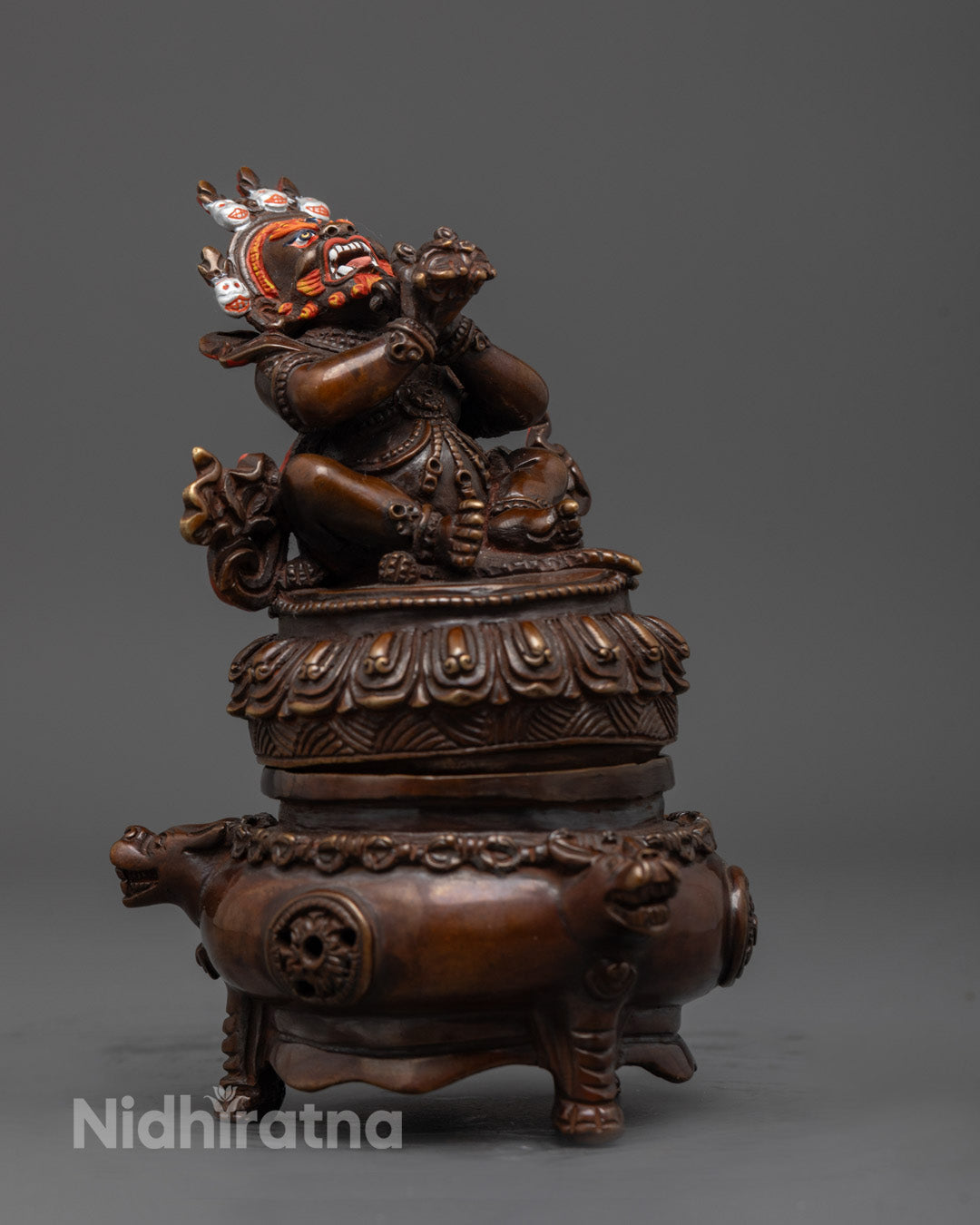 Side view of Vajradhaka Statue holding vajra, symbolizing fierce protection and wisdom