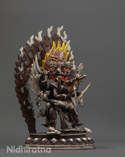 Side view of Vajrakilaya Statue with wings, blazing halo, and tiger skin garments