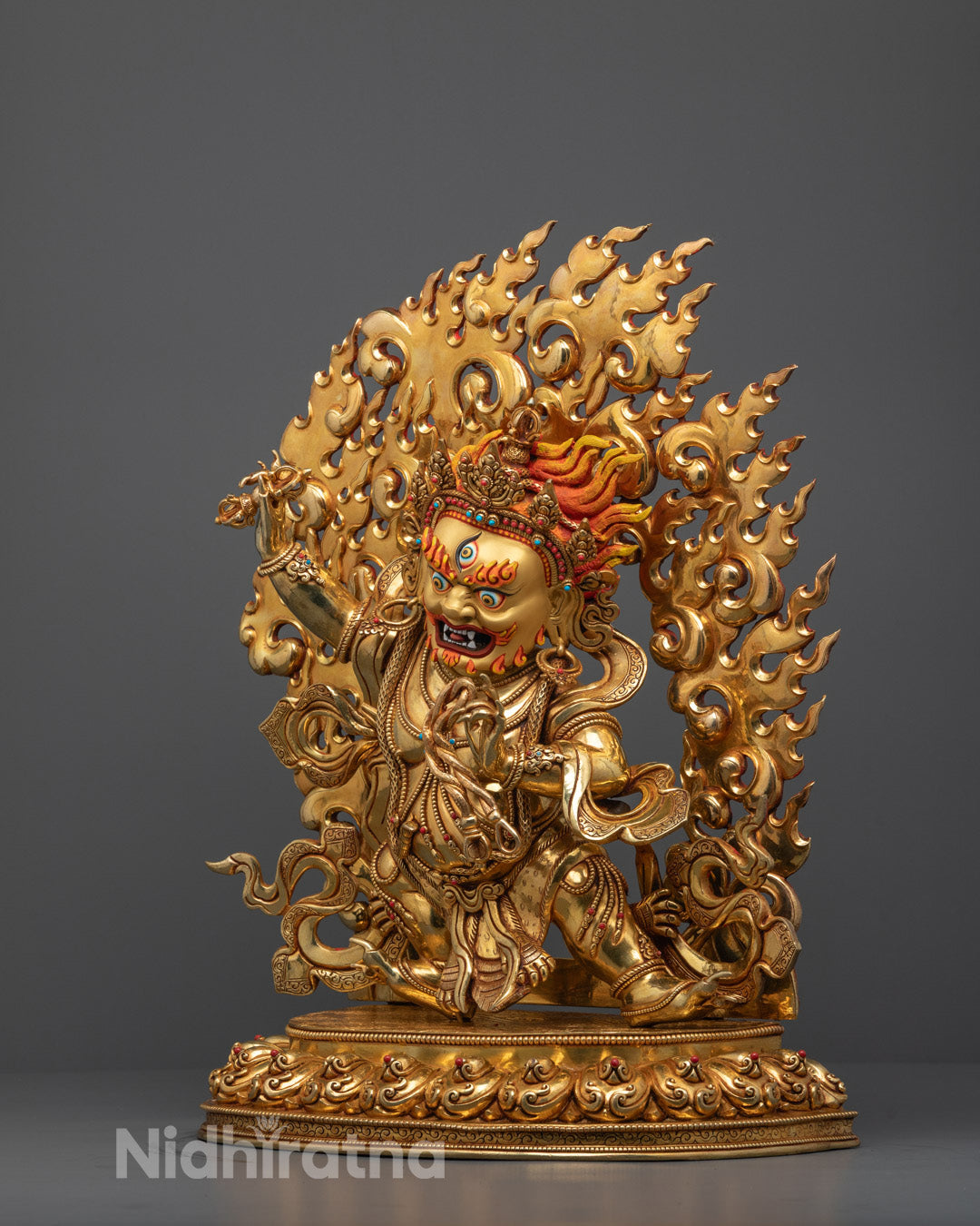 Side view of Vajrapani statue showing crafted halo and fine Nepalese craftsmanship