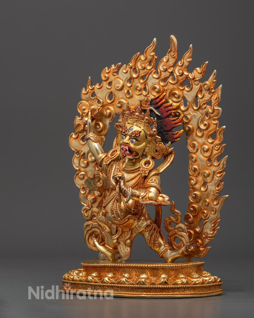 Vajrapani statue with flames of wisdom energy emanating from the body, crafted using the traditional lost wax method in Nepal.