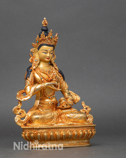 Side view of Vajrasattva Buddhist deity, handcrafted Nepalese copper with gold details