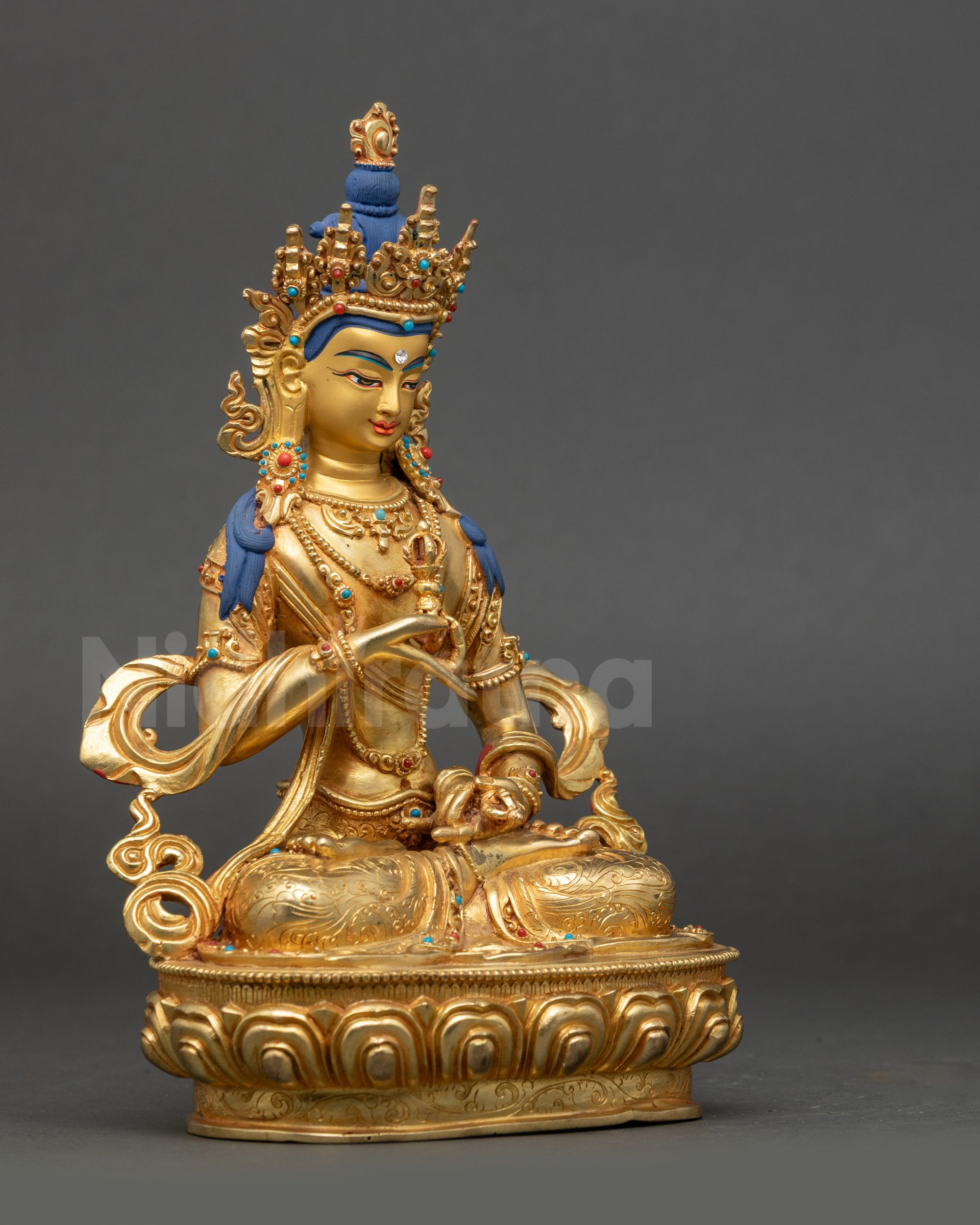 Side view of Vajrasattva holding vajra and bell, seated on lotus throne