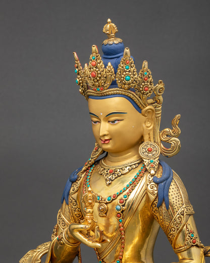 Side view of Vajrasattva statue gold gilded face Nepalese craftsmanship