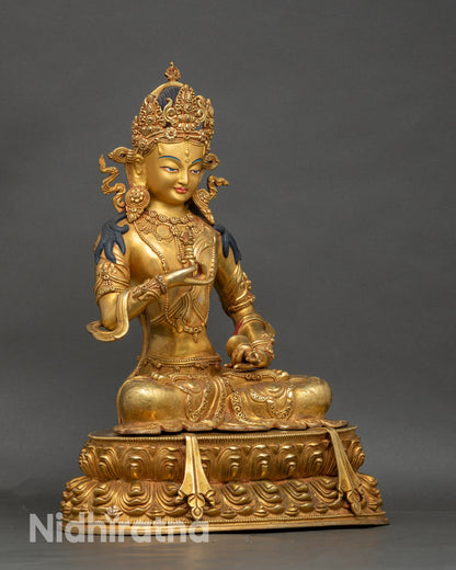 Side view of Vajrasattva statue holding vajra and bell, Nepalese Buddhist art