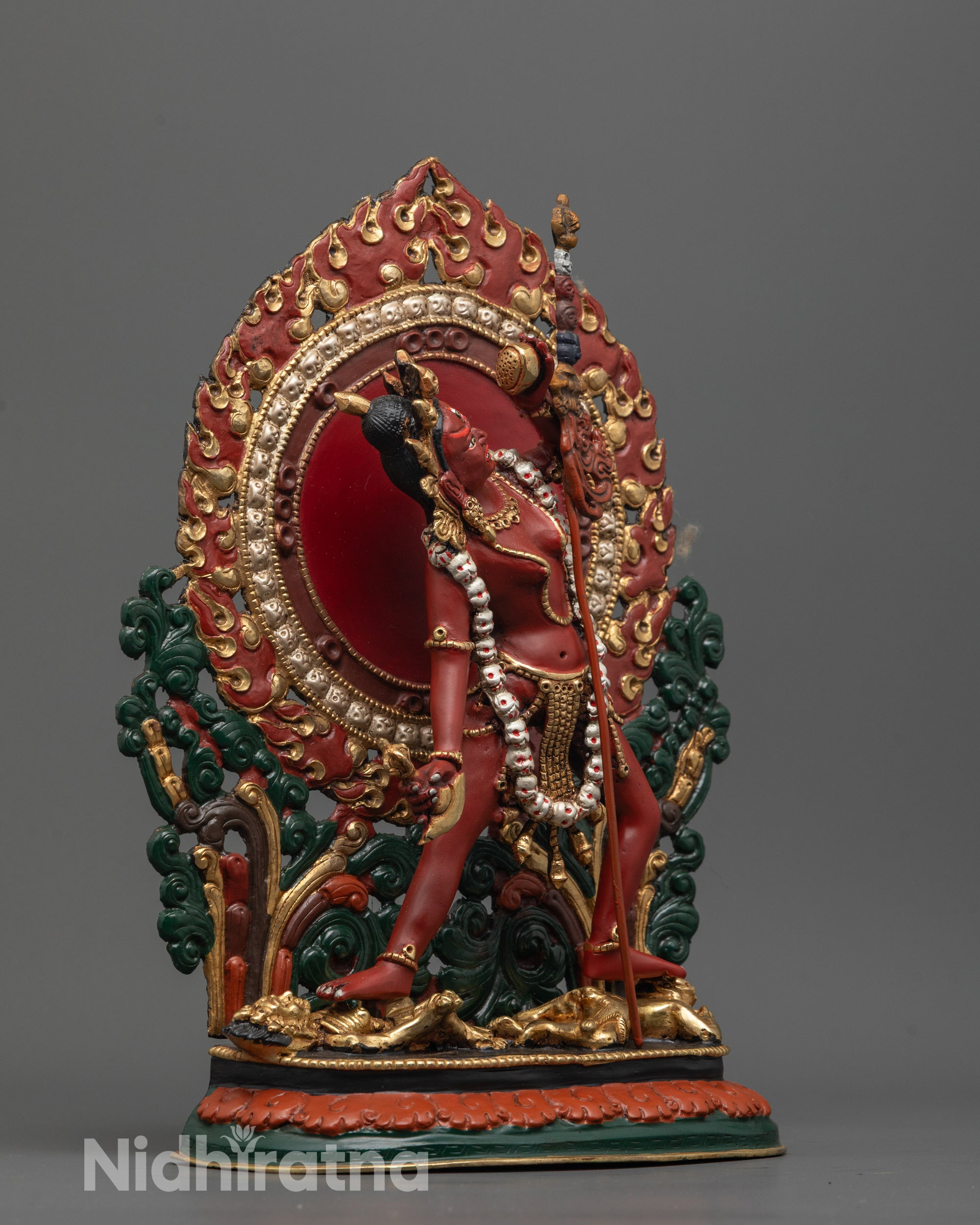 Side view of Vajrayogini Statue standing on two subdued human figures