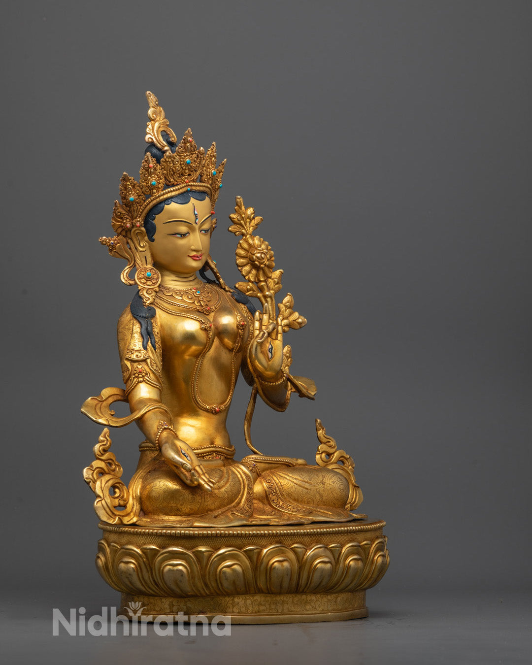 Side view of White Tara Statue highlighting Seven Eyes on hands