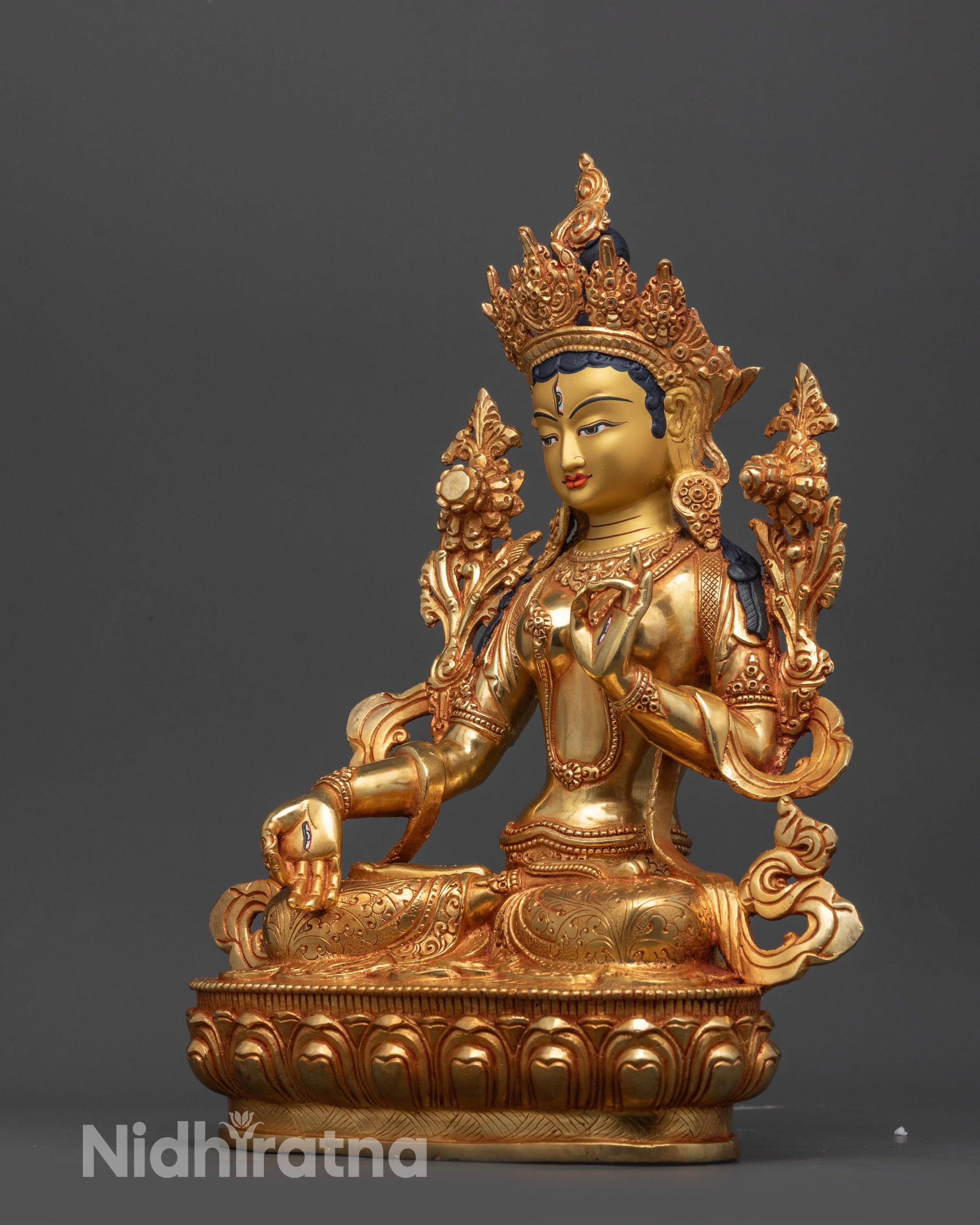 Side view of White Tara Statue seated on lotus with graceful posture and divine craftsmanship
