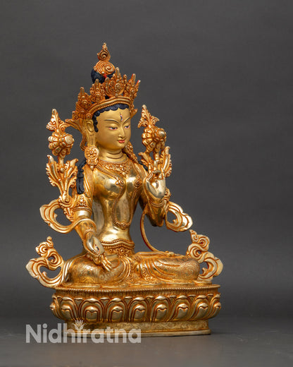Side view of White Tara statue with varada mudra hand gesture and lotus stem, Nepalese craftsmanship