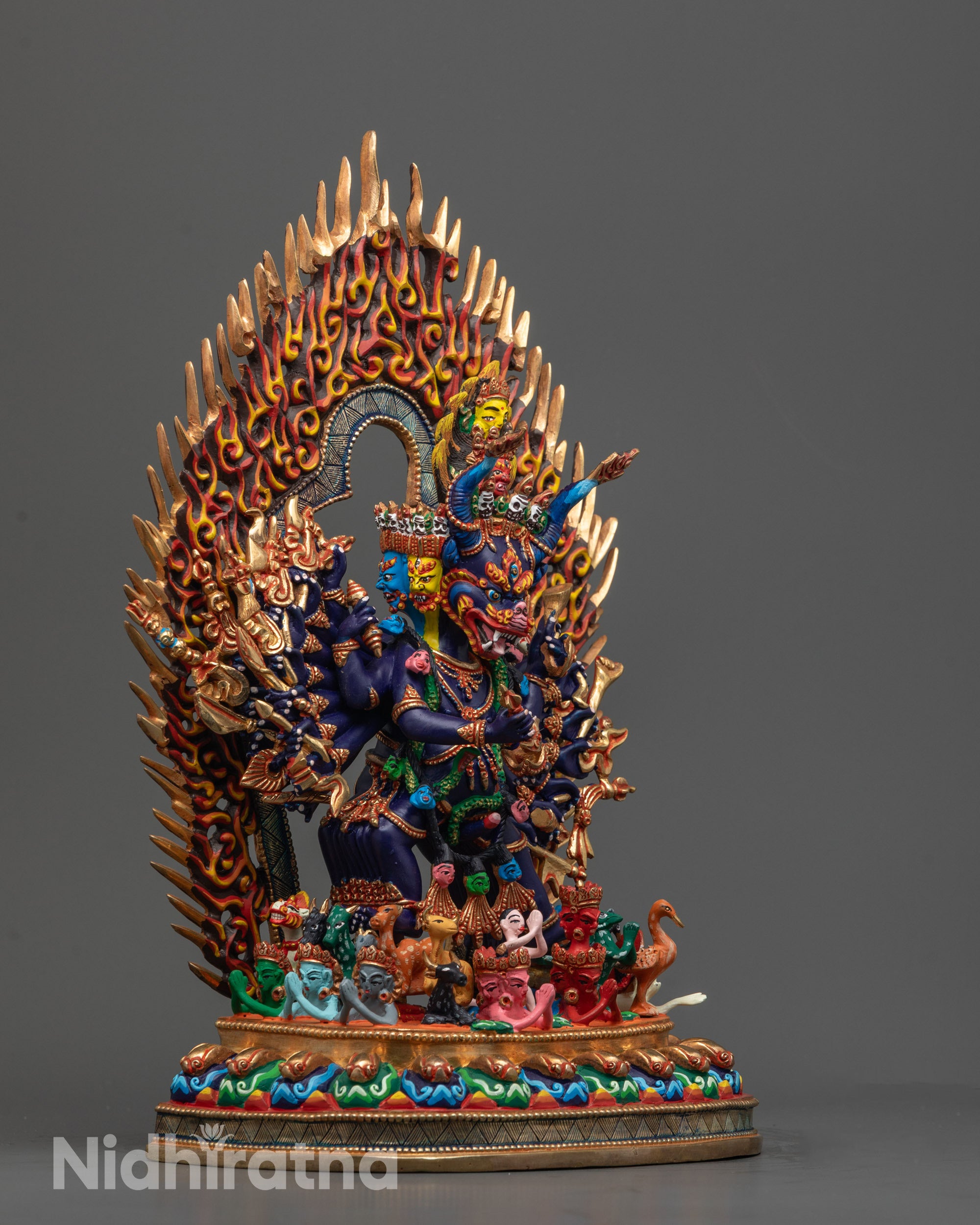 Side view of Yamantaka Statue showing multiple symbolic objects in arms
