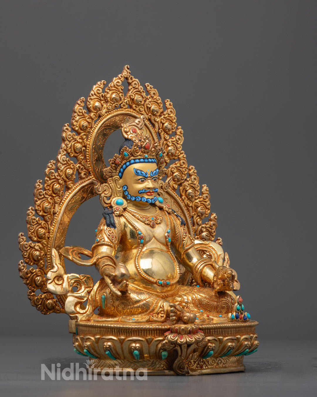 Side view of Yellow Dzambhala Sculpture adorned with semi-precious stones