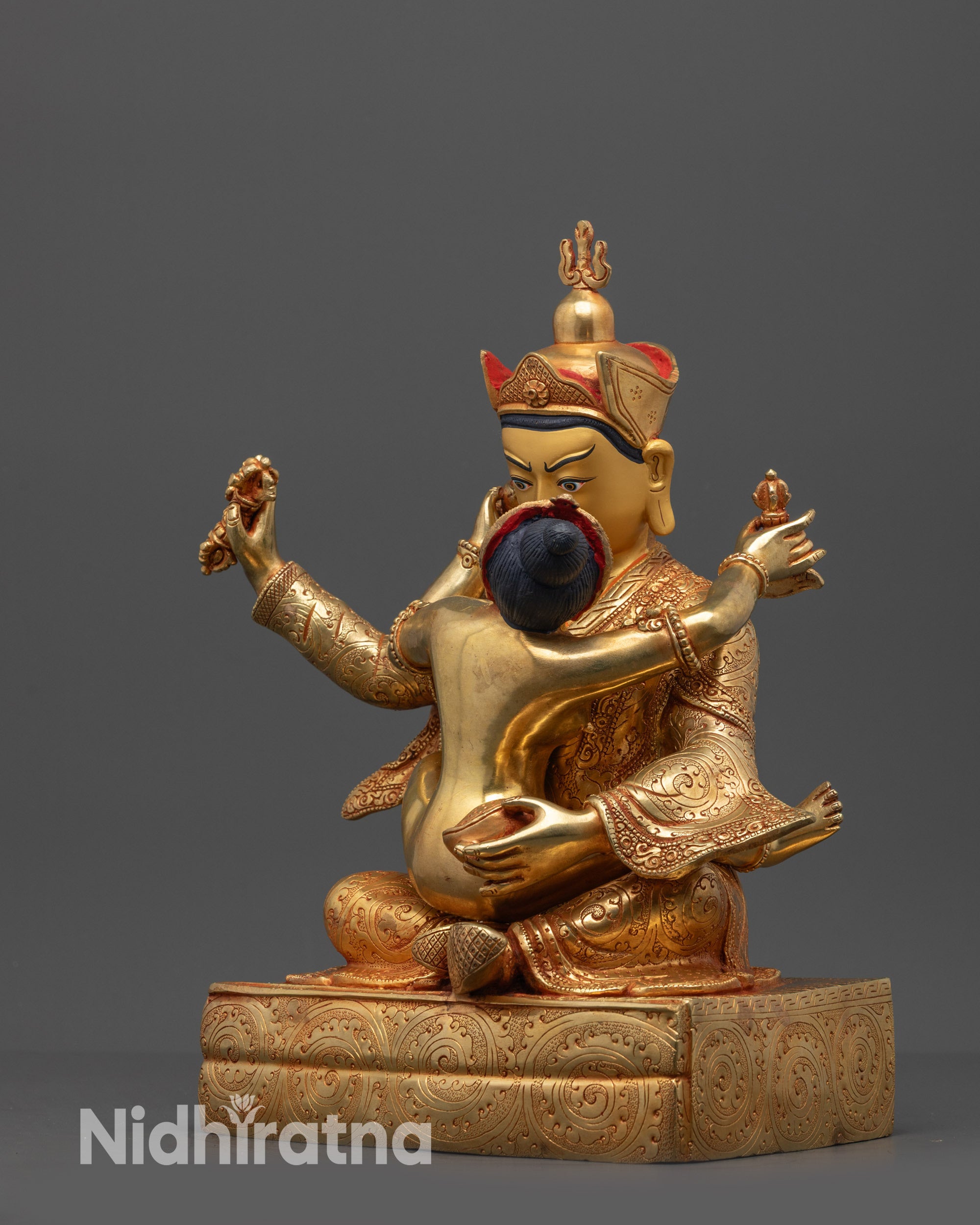 Side view of Yeshe Tsogyal holding kartika knife and kapala in gold finish