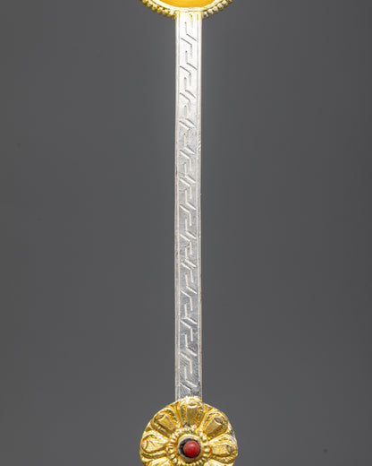 Side view of copper Tibetan Spoon with gold and silver-plated finish
