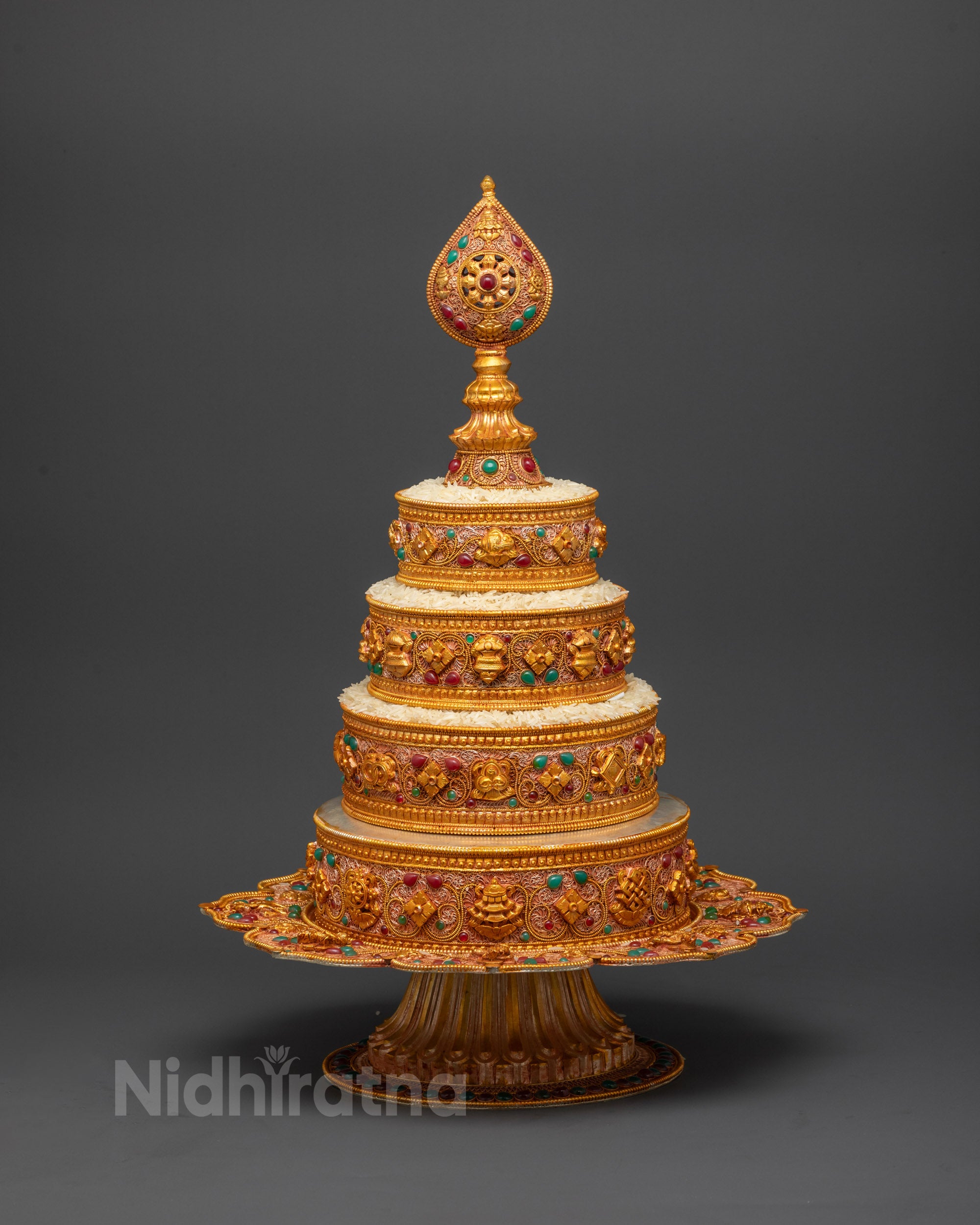Side view of gold-plated auspicious symbols on 8" Tibetan Austa Ratna Mandala