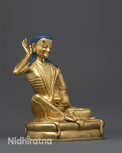 Side view of hand-crafted Nepalese Milarepa statue showing intricate carvings
