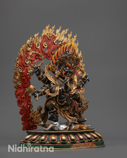 Side view of hand-painted Six-Armed Mahakala Statue showing six arms and weapons
