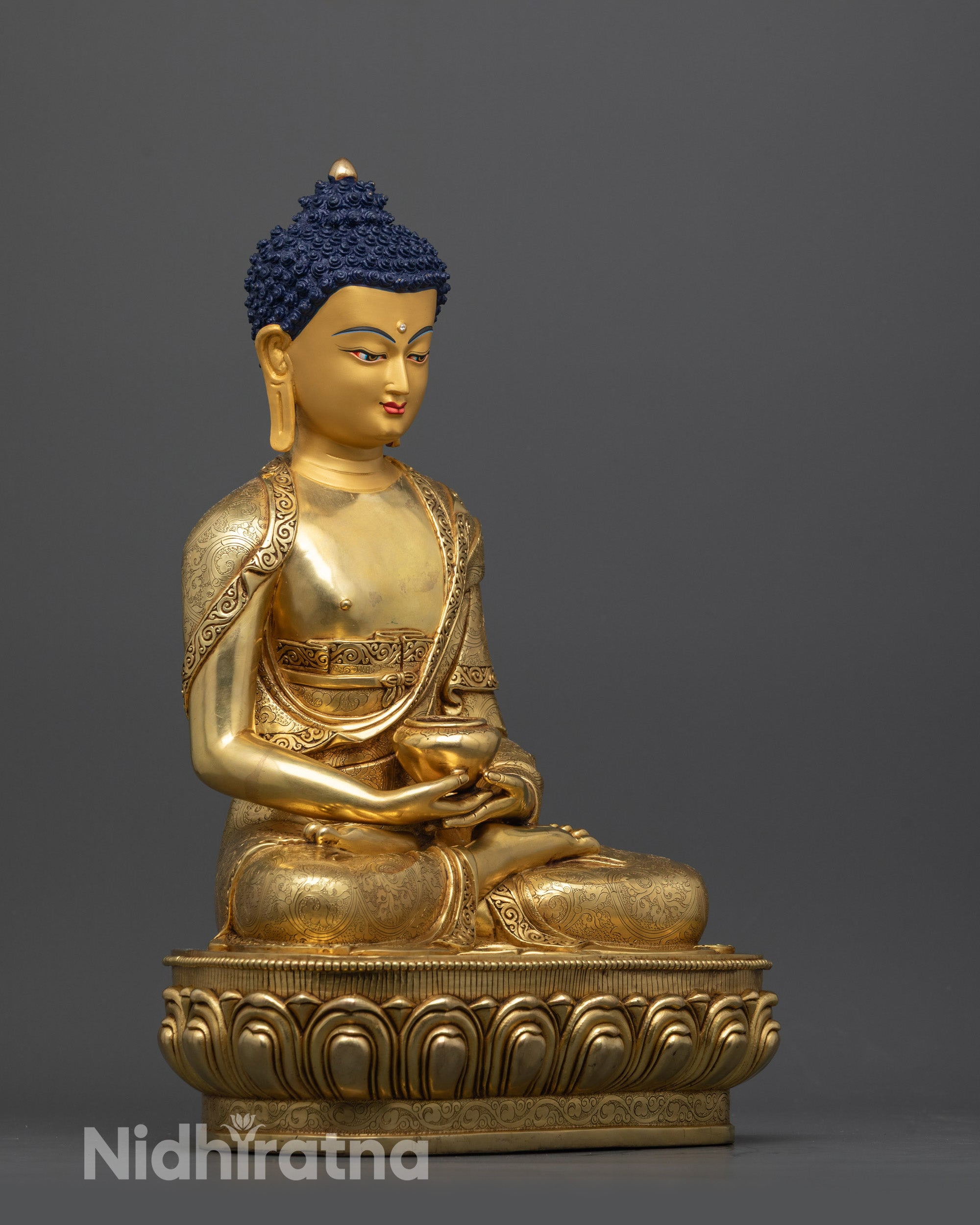 Side view of handcrafted Amida Buddha holding monk's bowl in dhyana mudra on lotus seat