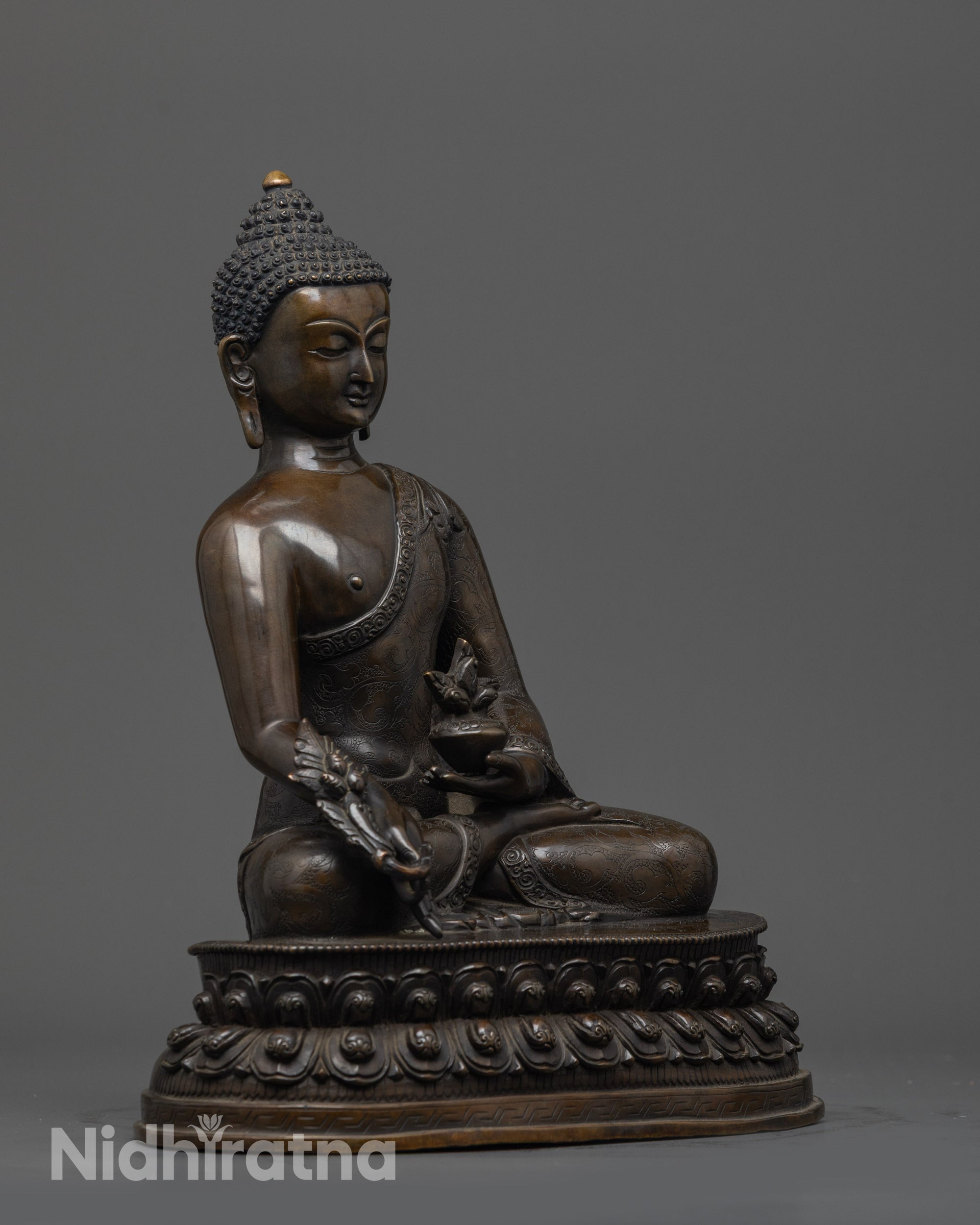 Side view of handcrafted Bhaisajyaguru Buddha Statue with earthy hue details