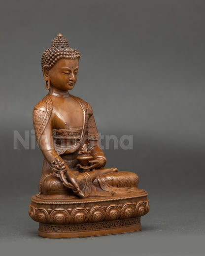 Side view of  Medicine Buddha statue showing lotus seat, healing nectar jar, and Myrobalan fruit for spiritual restoration