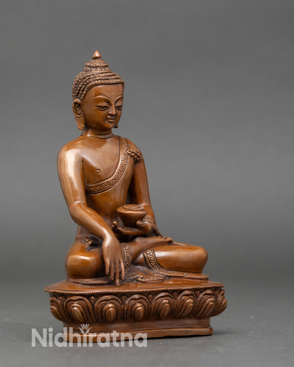 Side view of handcrafted Nepalese Buddha Shakyamuni meditation sculpture on lotus seat