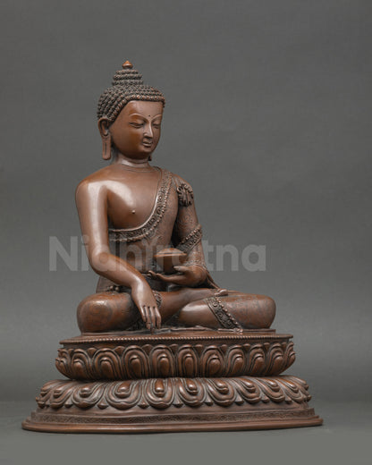 Side view of handmade Shakyamuni Buddha statue on double lotus throne