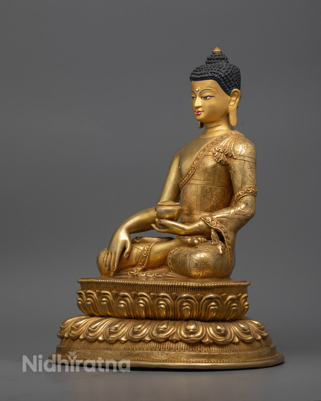 Meditation Buddha statue displaying Dhyana mudra hand position and intricately carved lotus pedestal with gold detailing